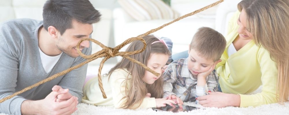 happy family with string bow keeping them together