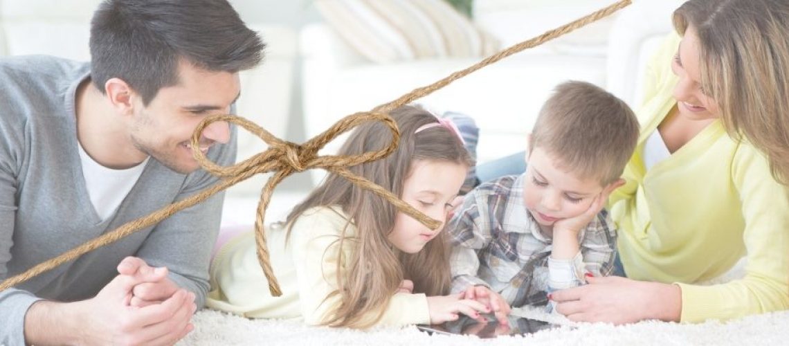happy family with string bow keeping them together